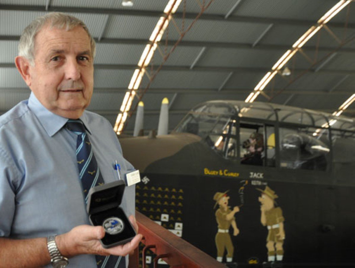 RAAFA State President Graeme Bland with the 100 Years of Military Aviation coin donated by The Perth Mint.